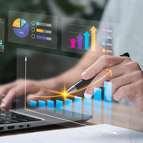 Woman's hands working on laptop with charts of analyze growth information laid over photo