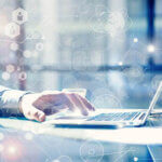 Man Typing Keyboard Laptop Hand.Project Manager Researching Process.Business Team Working Startup modern Office.Global Strategy Virtual Icon.Innovation Graphs Interfaces.Analyze market stock.Blurred