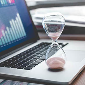 Open laptop with an hourglass on it