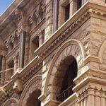 Close up of the architectural detailing of a refurbished heritage sandstone building. Now retail and office space. former headquarters for the American Equitable Life Assurance Society