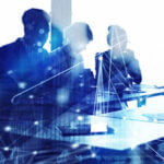 Silhouette of group of people working with dotted computer image over laid on it