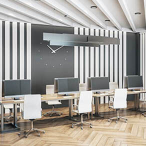 Coworking office interior withclock on the wall and computers. Workplace and lifestyle concept. 3D Rendering
