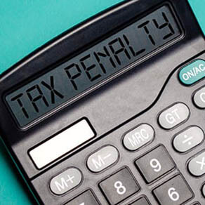 TAX PENALTY word on calculator. Business and tax concept. Time to pay tax in year.