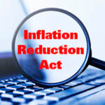 Laptop computer with magnifying glass, concept of search