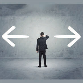 Silhouette of man standing pondering what to do with arrows pointing in each direction