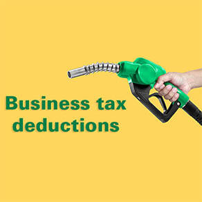 Hands holding Fuel nozzle on yellow background with the words