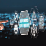 Finger pointing to computer image of the words "Business Continuity"