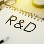 notebook written with R&D written in large type