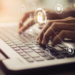 Hands typing on a keyboard with lock graphics over laid over image