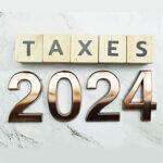 Taxes 2024 alphabet letter on marble background