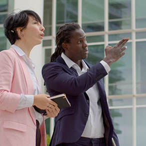 Man pointing to something while woman looks on
