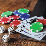 Poker chips, cards and dice in a pile