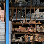 Construction building materials and industrial supplies stacked up on a shelving unit