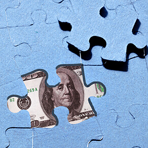 U.S. dollar and jigsaw puzzle, concealment of income, hidden assets, tax avoidance