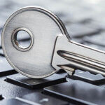 Key resting on computer keyboard