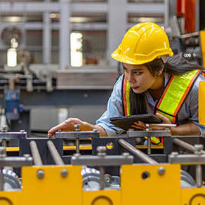 Female Engineer inspecting equipment