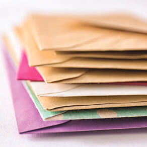 A stack multi-colored envelopes