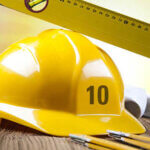 Building and construction equipment on blueprints