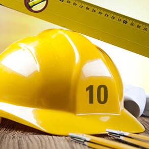 Building and construction equipment on blueprints