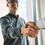 Two business men shaking hands