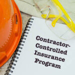 Work Place Safety and Health at Workplace Concept with WORK INSURANCE wording on notebook