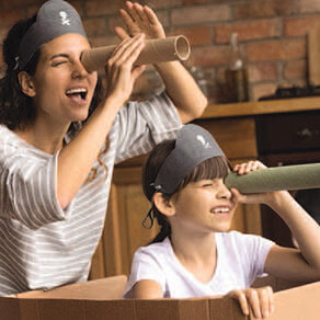 Nanny and child playing as pirates