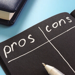 Black paper with white marker writing out the words 