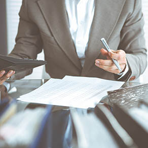 Bookkeeper woman or financial inspector making report, calculating or checking balance, close-up. Business, audit or tax concepts.