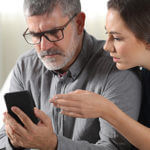 Man and Woman looking at phone