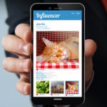 Mobile Phone Close Up With influencer App Open
