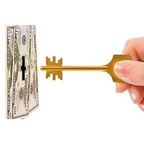 fifty dollar bills with hole in shape of lock and someone putting key up to it