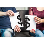 Money symbol on a sign ripped in half