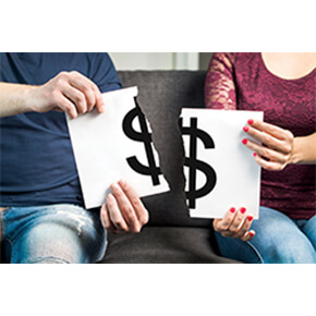 Money symbol on a sign ripped in half