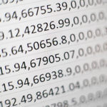 Paper with a bunch of numbers written all over it