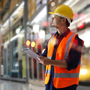 Manager warehouse. Worker checking and loading products and tracking delivery with a tablet on global network. Import export. Smart logistics and transportation concept.