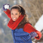 Woman outside ready to throw a snowball